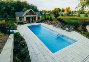 An inground swimming pool designed and built by Hipel Pools a pool company based in Kitchener, Ontario