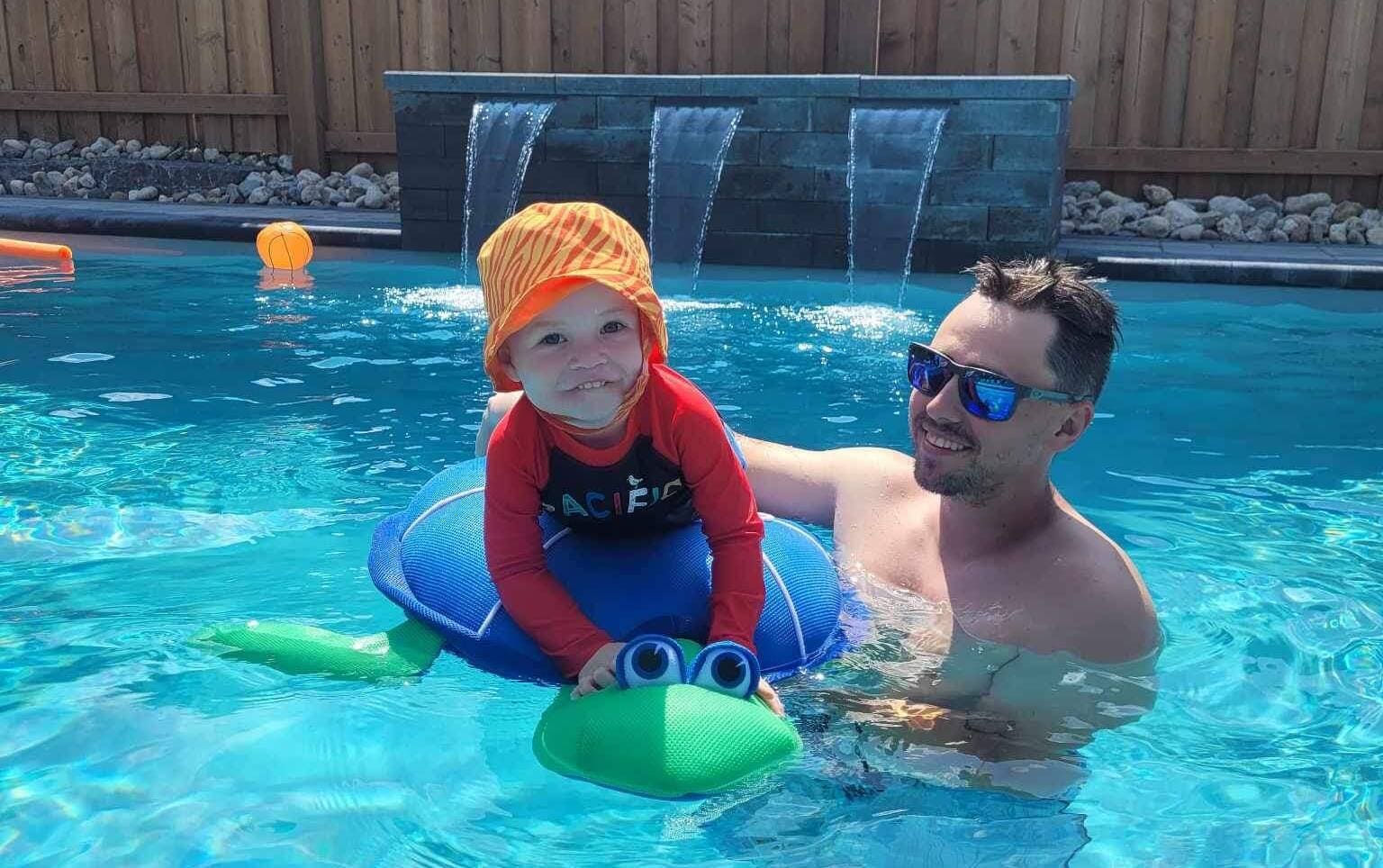 Father and Son enjoying a fiberglass pool in kitchener, waterloo, cambridge, guelph