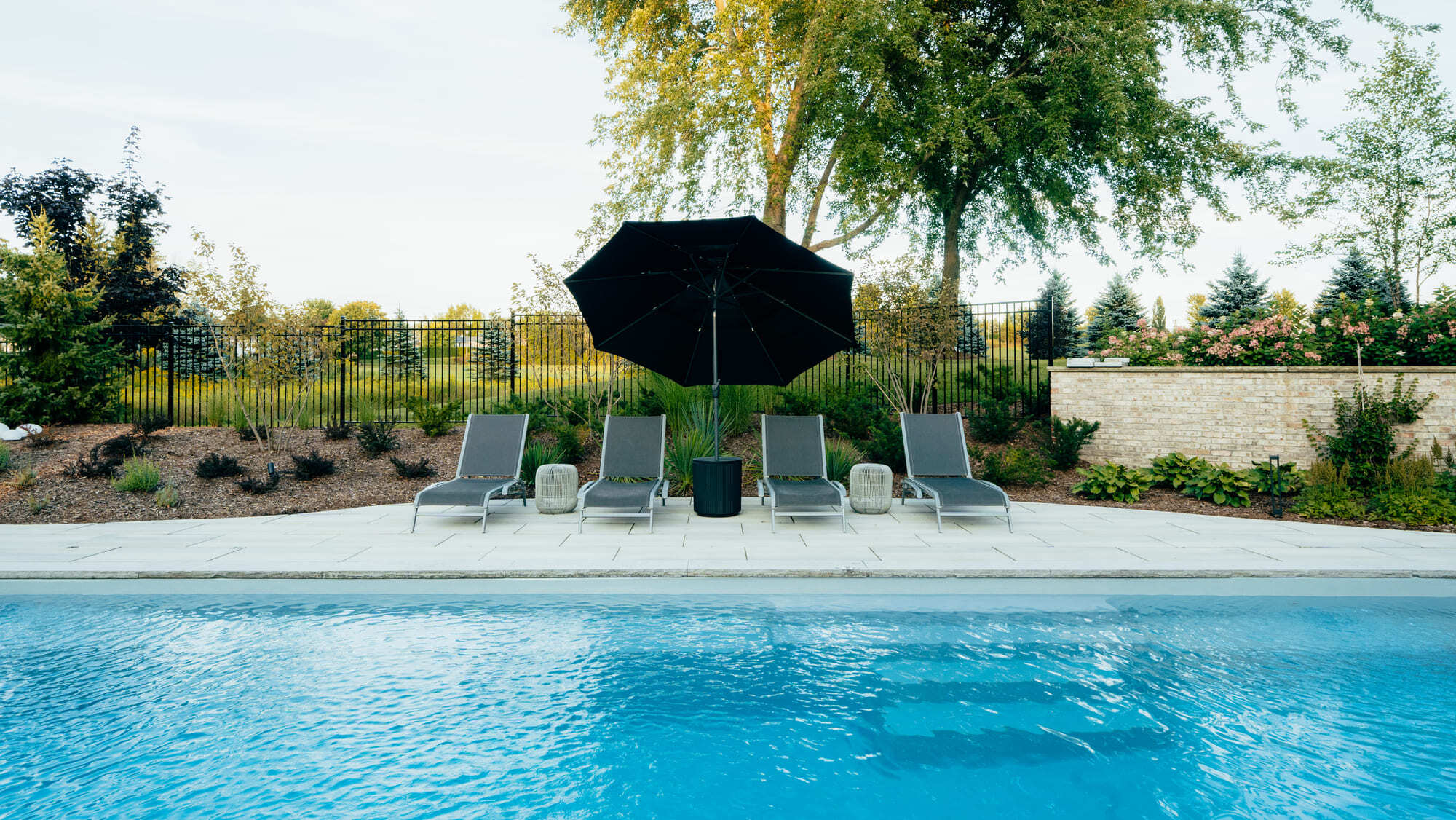 Poolside retreat beside an inground fiberglass pool in Cambridge, ON
